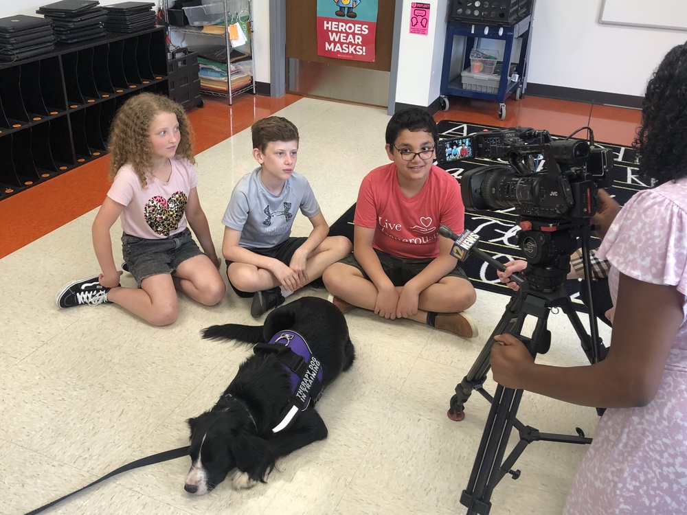 Students do an interview with KFVS on how much they love Maggie, our new therapy dog!