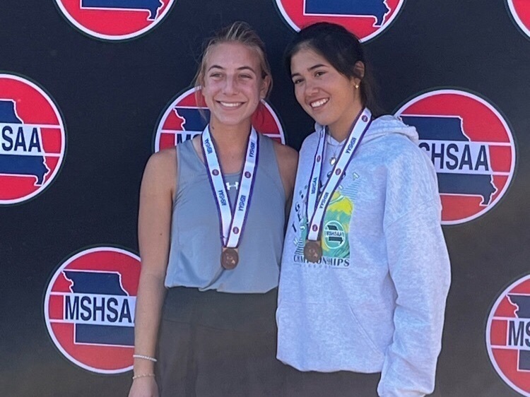 Megan Maxton and Maria Mijangos pose together at the state tennis tournament 