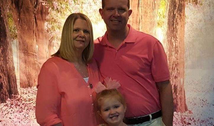 Mrs. Rhinehart is pictured with her husband and daughter. 
