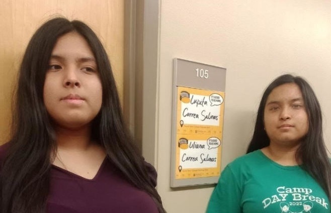 Liliana Correa Salinas and Lupita Correa Salinas are pictured standing in front of their door room at MIZZOU.