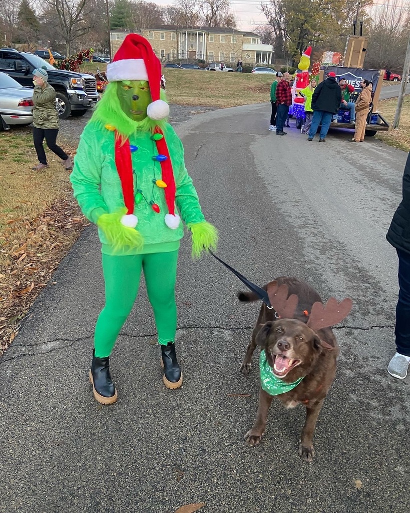 Ms. Dunn poses with her pup as they prepare for the Parade of Lights.