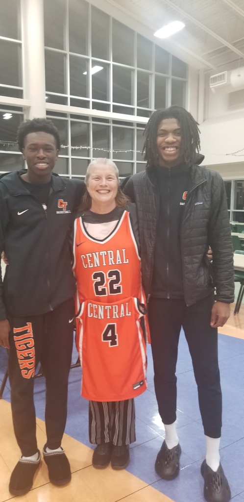 Mrs. Taylor with two basketball players