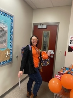 Ms. Edwards enjoys the orange!