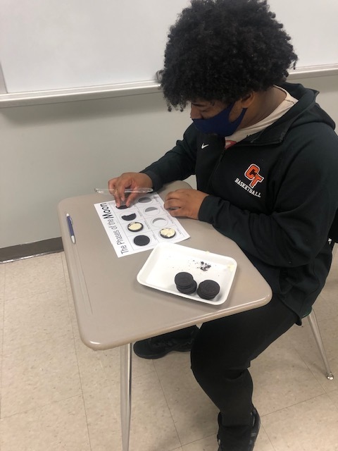 Student matches cookies to moon phase.