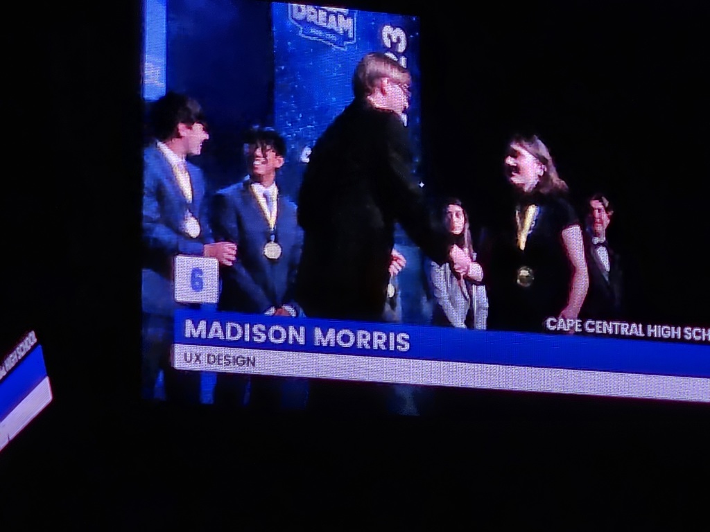 Madison accepts award.